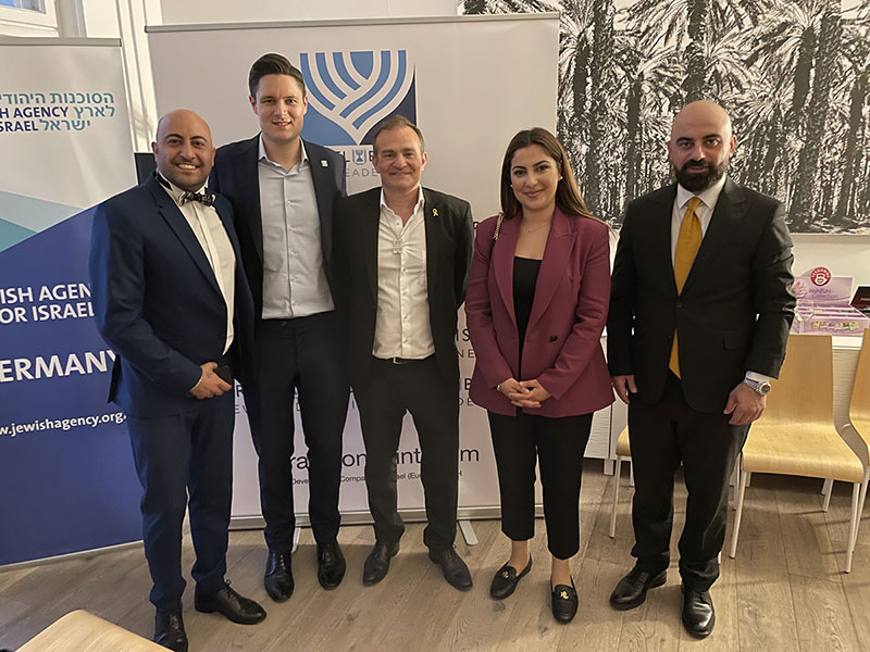 DE-NL-Event-Photo-Group Grateful for allies who show up with heart, across borders, faiths, and backgrounds. Pictured left to right: Mr. Wael Salibi, entrepreneur and member of the Syrian Catholic community; Sebastian Hoffmann, Chair of Israel Bonds New Leadership, Germany; Michael Grauss, Managing Director of Israel Bonds in Germany; Zelal Papo, board member of the CDU Altona and chairwoman of the International Cultural Academy in Hamburg; and Karker Tamur, representative of the Kurdish Democratic Students and Young People’s Union of Europe.