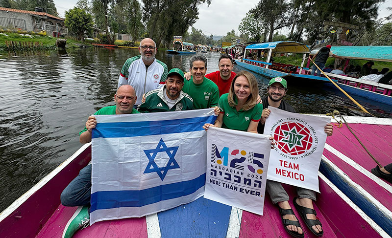 MX-Maccabi-photo-boat Daniel Wulfovich, President of Mexico’s Maccabiah Committee (center), with fellow committee members in Xochimilco to celebrate the start of the Maccabi Games.